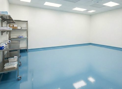 Sterylne pomieszczenie laboratoryjne z regałami ze stali nierdzewnej i posadzką w kolorze błękitnym pastelowym RAL 5024.